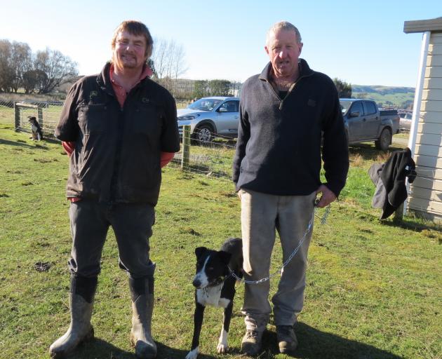 Sheep, beef and venison farmer Richard Tucker (left), of Becks, bought heading dog Glen for $10,200  from his breeder David Parker, of Teviot Valley, during the recent sheep and cattle dog sale at Charlton sale yards, Gore. Photo: Yvonne O'Hara