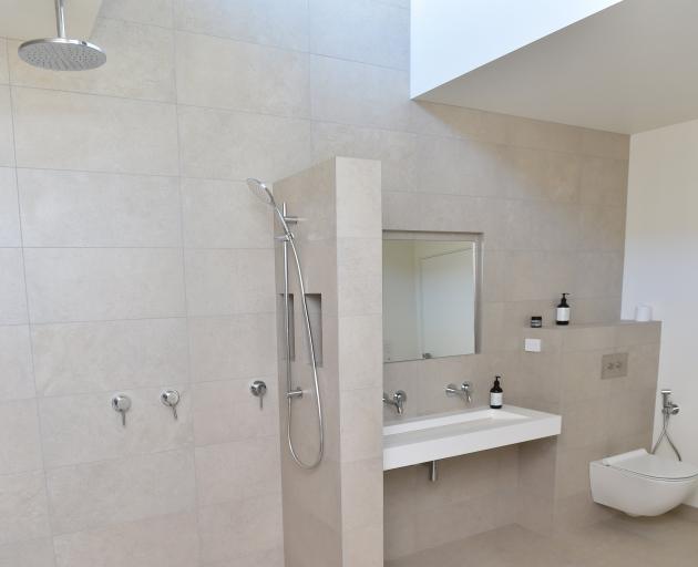A long slim basin fits with the minimalist-style bathroom.