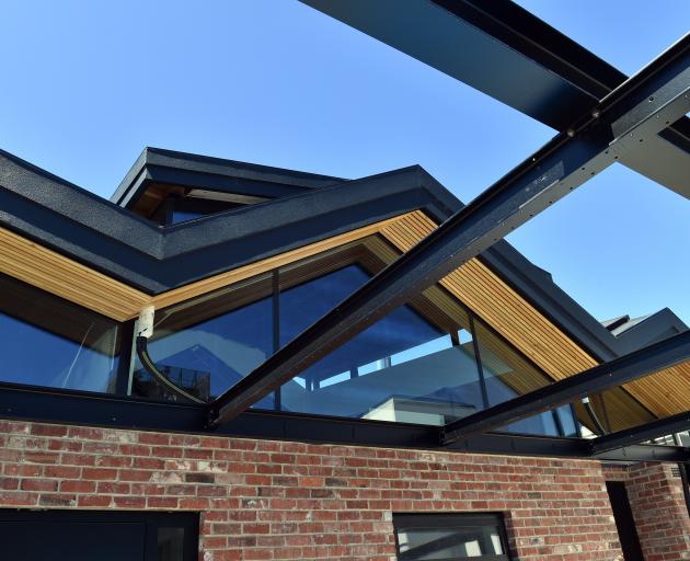 Steel and vintage bricks feature in the roof-top garden. The pergola will be partially covered.