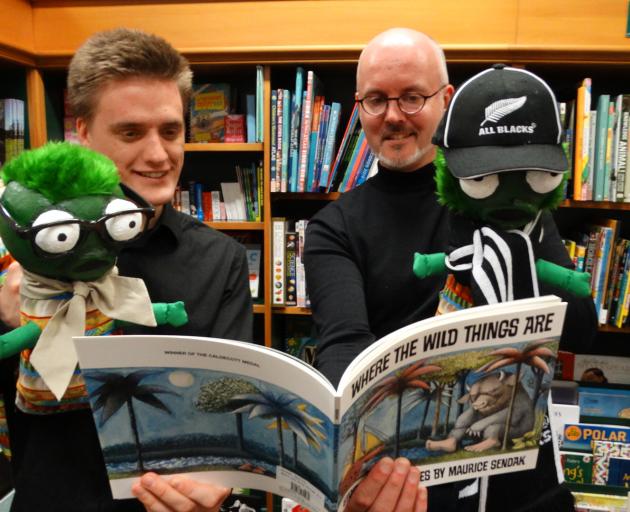 Oscar Macdonald (left) and Jonathan Cweorth with puppets of the bookworm and his sister. PHOTO: BRENDA HARWOOD
