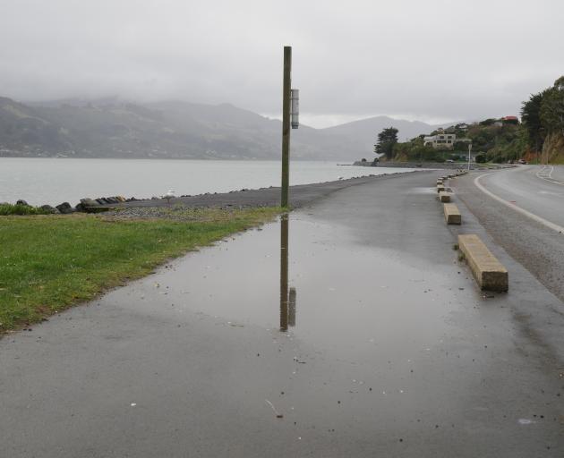 One of the large puddles affecting the ease in which pedestrians and cyclists can use the...