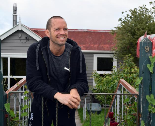 Tim Doidge, pictured outside his City Rise home, is using bodybuilding to aid his recovery from a rare brain disorder. PHOTO: SHAWN MCAVINUE