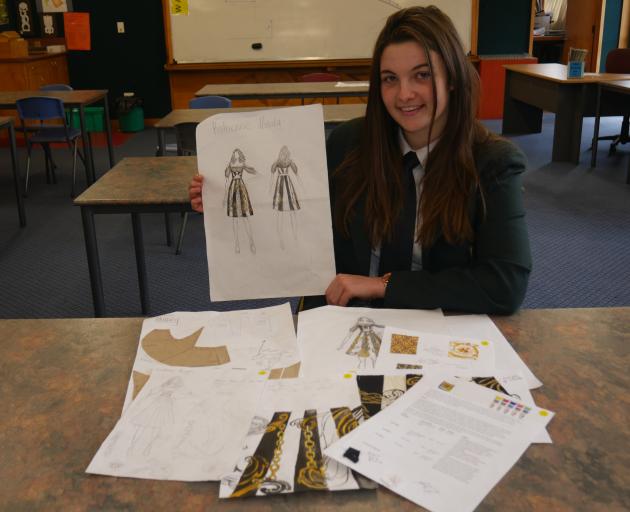 Bayfield High School pupil Charlotte Fuller holds a sketch of a dress that landed her second...