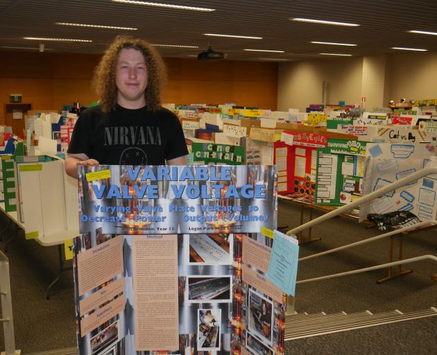 Logan Park High School pupil Karl Brinsdon (17) shows off his project at the Science and...