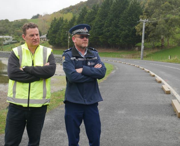 Otago Peninsula Community Board chairman Paul Pope (left) and Senior Constable Aaron Smith are...