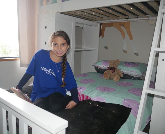 Ariah Gillon-Smith shows off her new loft bed, which she got as part of her bedroom makeover by...