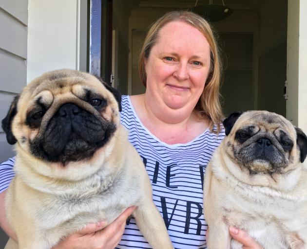 Fiona Martin and her pugs Dominic (left) and Rosie at home in Abbotsford on Tuesday. PHOTO: SHAWN...