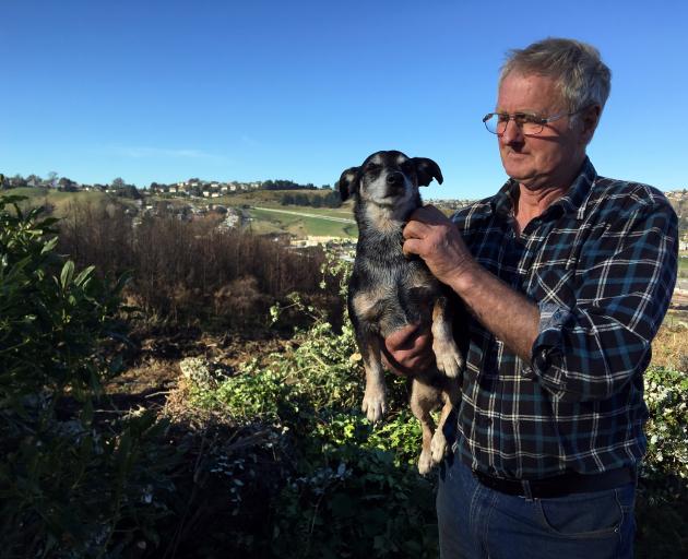  Greenwaste owner Bob Gillanders pats his dog Patch at his Burnside green-waste disposal business...