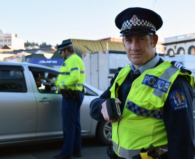Acting Senior Sergeant Blair Dalton, of Dunedin, runs a checkpoint to breathalyse motorists in...
