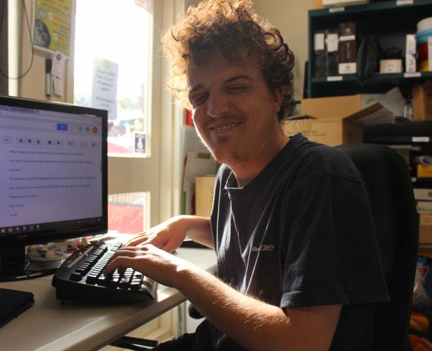 Rorie White keeps himself busy in the office at The Valley Project. PHOTO:ELLA STOKES

