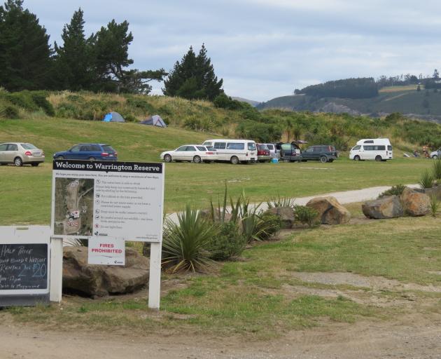 Freedom campers set up at Warrington Reserve, the busiest freedom camping spot in the Dunedin...