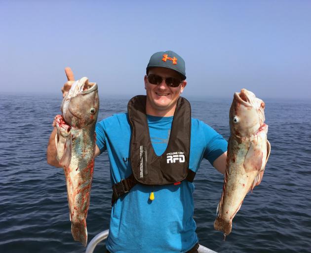 Darren Smeaton, of Mosgiel, shows off blue cod he  caught fishing on  the 15m catamaran Fierce Elegance in Dunedin earlier  this month. PHOTO: SHAWN MCAVINUE