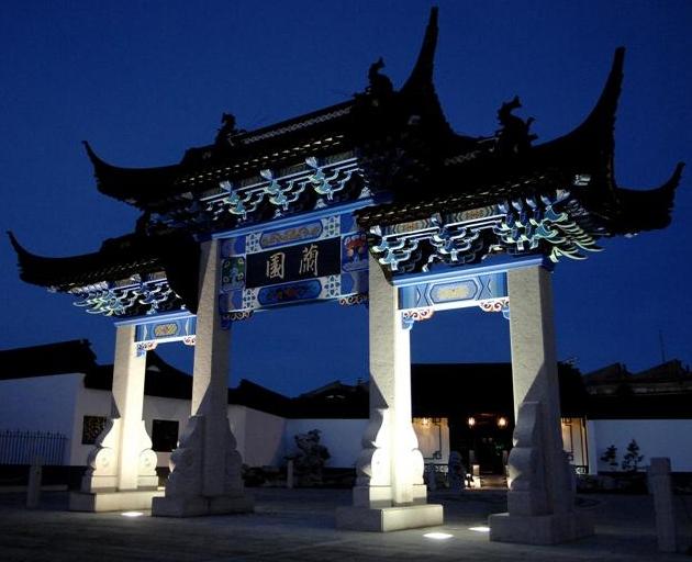 Night illumination brings out detail on the elaborate archway, or Pai Lou, which leads to the...