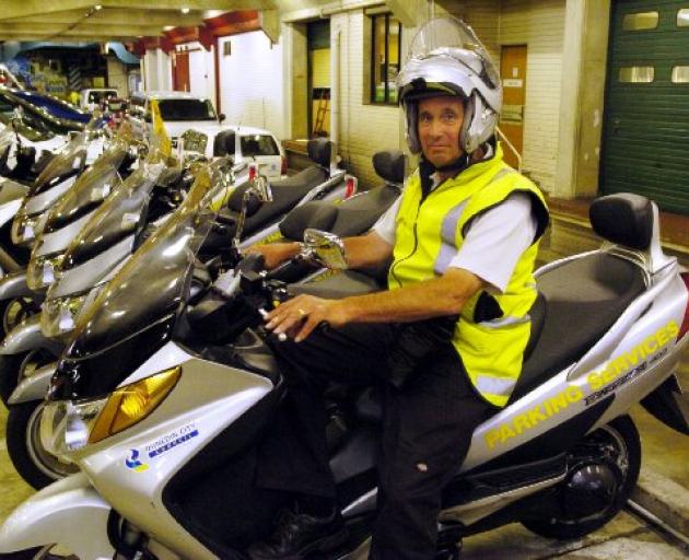 Parking officer Brian Benson, back at work yesterday after his scooter was let loose in Albany Street. Photo by Gerard O'Brien.