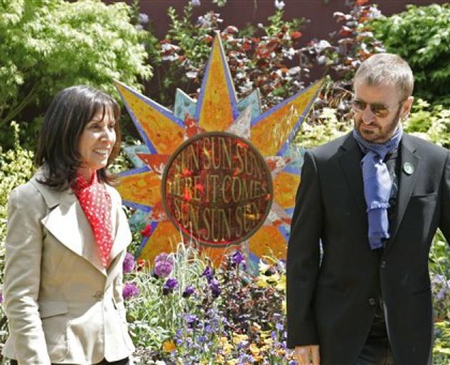 Beatles drummer Ringo Starr, and Olivia Harrison, widow of George Harrison, look at the show...
