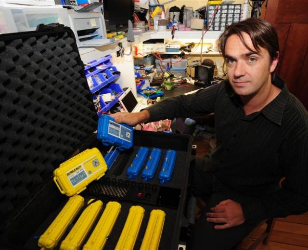 Igtimi Ltd director Brent Russell packs GPS tracking equipment in Dunedin last week. It  will be...