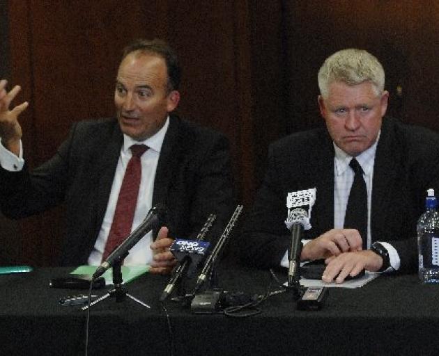 ORFU chairman Wayne Graham (left) and NZRU chief executive Steve Tew break the news to supporters...