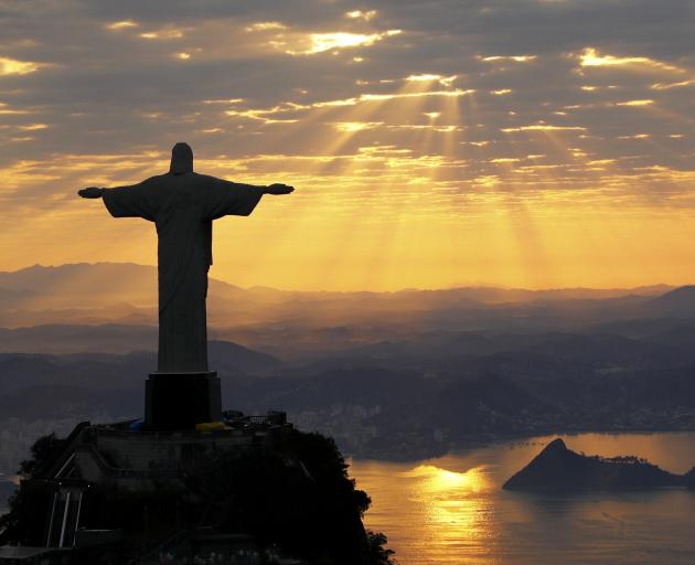 Christ The Redeemer is seen at  sunrise in Rio de Janeiro  this week.  Photo by Reuters.