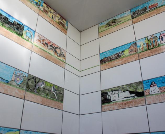 Owaka's new toilets feature ceramic tiles designed and painted by Catlins Area School pupils. Photo by Samuel White.