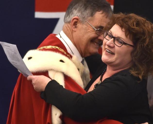 Joanne Smith hugs Dunedin Mayor Dave Cull at a citizenship ceremony at the Clifford Skeggs Gallery in Dunedin yesterday. Photo by Peter McIntosh.