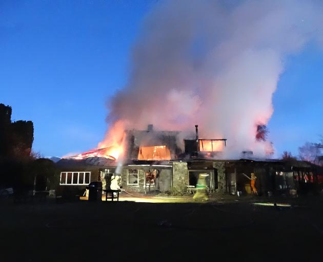 Historic Cluden Station homestead in Tarras is consumed by fire last night. Photo by Mark Price.