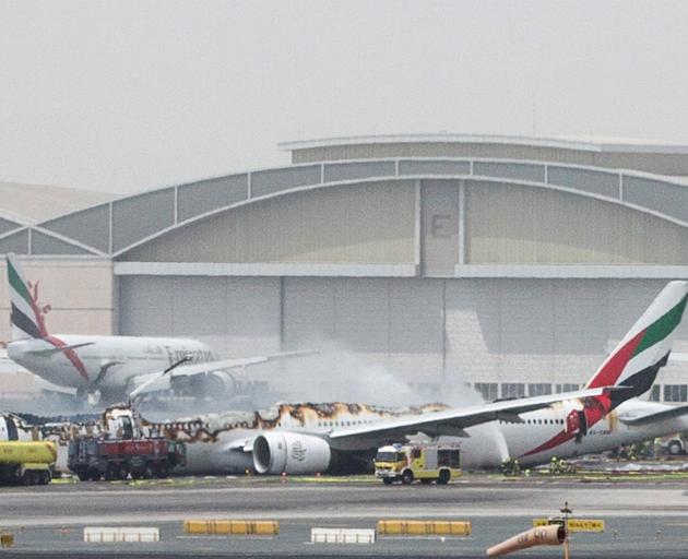 An Emirates Airline flight is seen after it crash-landed at Dubai International Airport. Photo:...