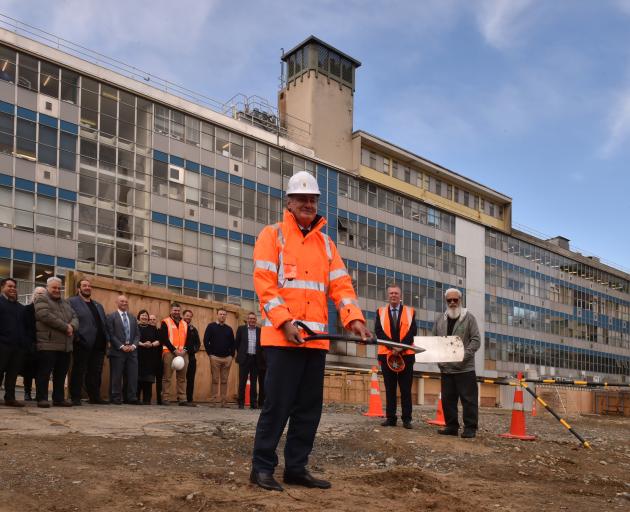 University of Otago chancellor John Ward turns the first sod at the site of the School of Dentistry's new clinical services building. Photo by Gregor Richardson.