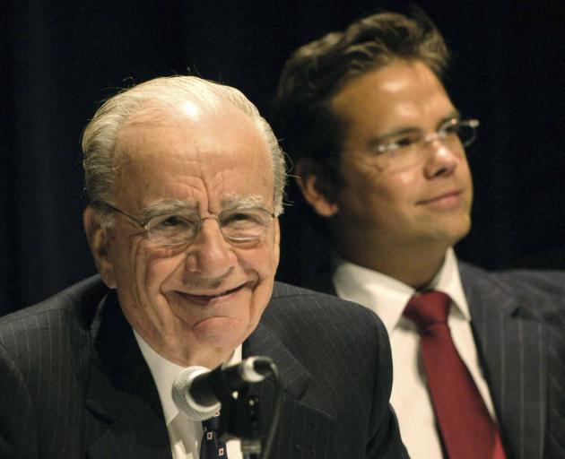 Rupert Murdoch (left), with son Lachlan next to him, after Newscorp profits doubled in 2003....