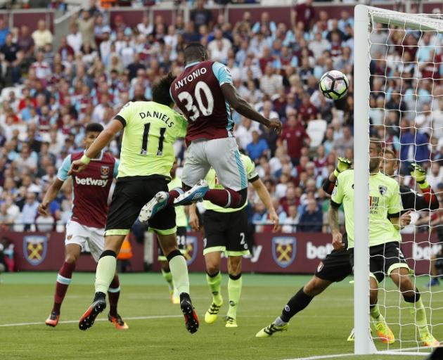 Michail Antonio heads the ball in for West Ham. Photo: Reuters