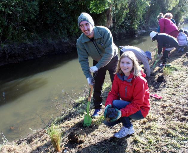 Sonya Lewthwaite and husband Jon Screech plant out the banks of a stream in Waiwhetu, Lower Hutt,...