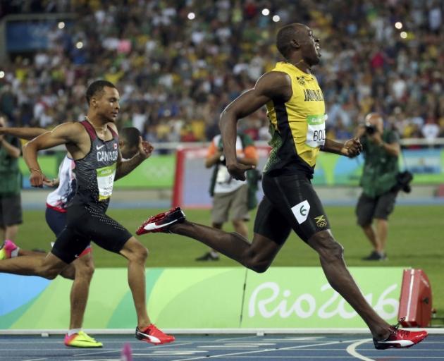 Usain Bolt crosses the finish line in the 200m final. Photo: Reuters