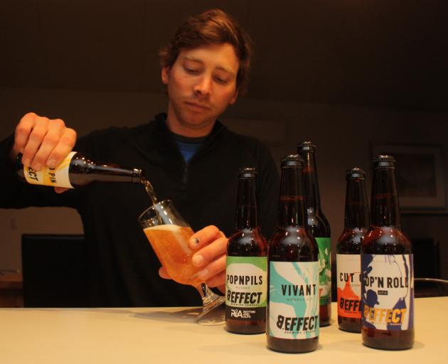 James Hay, founder of B.Effect brewery, creates the recipes for his beers on a small brew kit in...