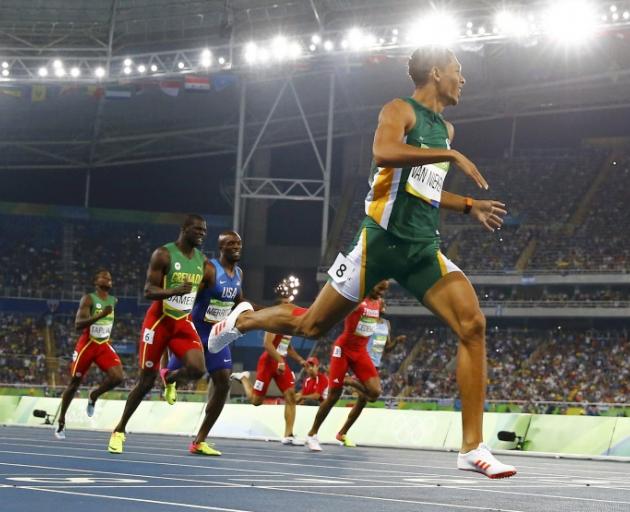 Wayde van Niekerk crosses the finish line as he broke the 400m world record. Photo: Reuters
