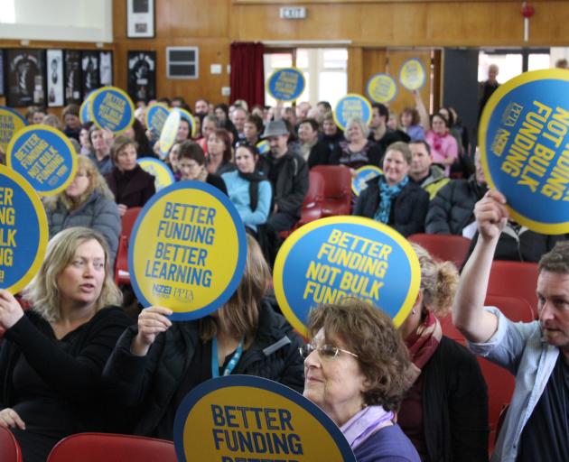 Central Otago educators wave signs in opposition to the Government's ''bulk funding'' proposal, at Dunstan High School in Alexandra yesterday. Photo by Jono Edwards.