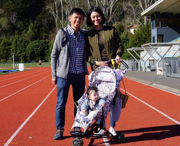 Symond Lim with wife Peili and baby Brooklyn, at the Caledonian Ground on Saturday. Photo: Wayne...