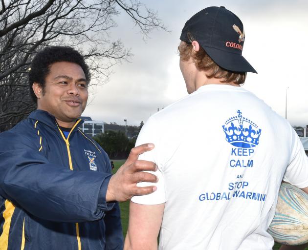 Otago University Seafarers captain Jake Maiono admires the shirt to be used by his team, as worn...