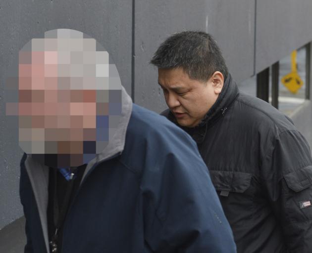 Limin Ma arrives at the Dunedin District Court yesterday for sentencing for careless driving causing the death of Dunedin man Riley Baker. Photo by staff photographer.