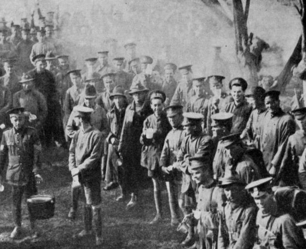 Hot drinks being served to the troops after the 17th Reinforcements night manoeuvres and route march over the Rimutaka Range. - Otago Witness, 27.9.1916.