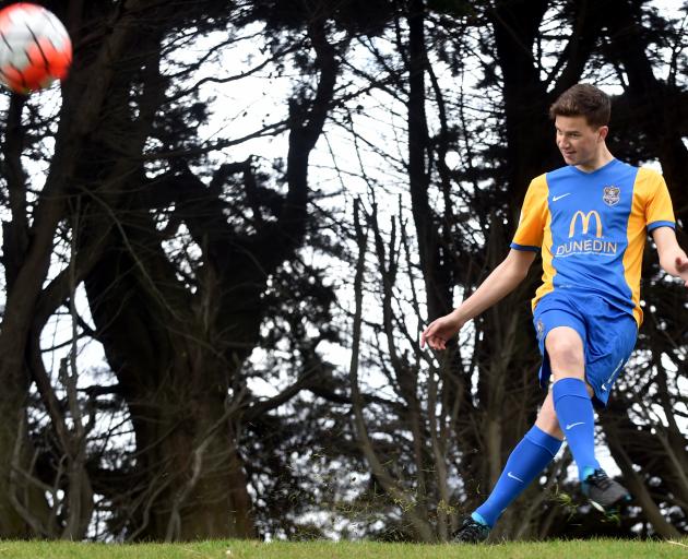 Southern United youth team player Riley Anderton (19) shows off the side's new strip at Tahuna Park yesterday. Photo by Peter McIntosh.