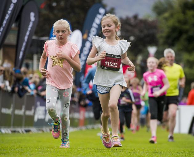 Scarlett Williams (right) and a friend pace their way to the finish line in the 2015 Kids' Run, part of the Queenstown Marathon. This year organisers are challenging children aged between 5 and 12 to complete a marathon in the eight to 10 weeks before the