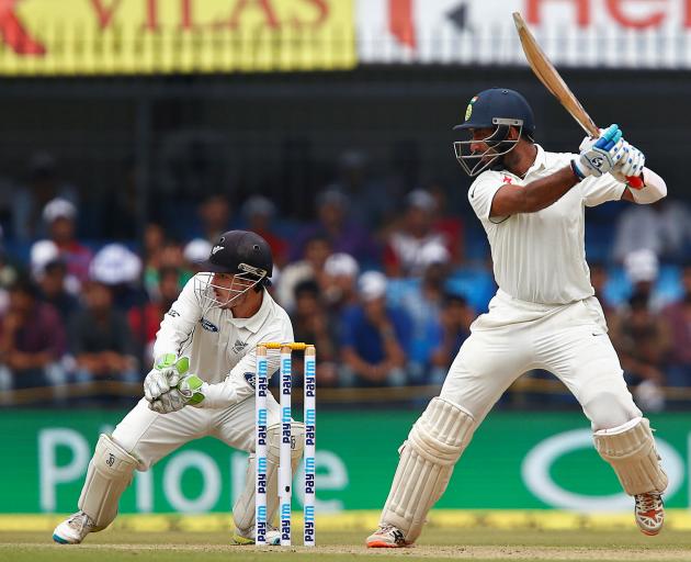 Cheteshwar Pujara plays a shot for India against New Zealand. Photo: Reuters