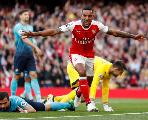 Arsenal's Theo Walcott celebrates after scoring their first goal. Photo: Reuters 