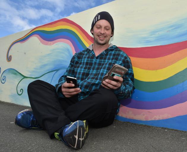 Brendon Carter checks his phones for some of the many messages of support he and his family have...