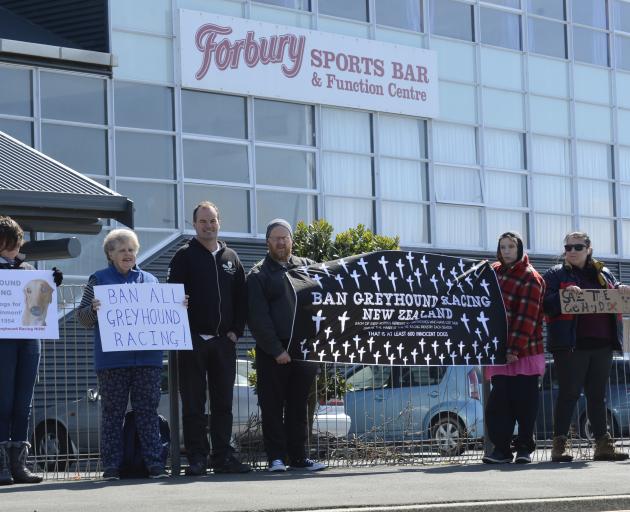 A small group of protesters stand outside Forbury Park raceway yesterday. Photos by Gerard O'Brien.