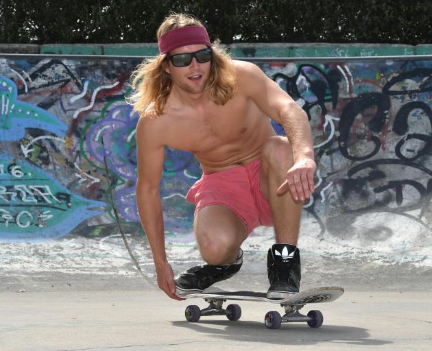 Jeremy Harvey (22), of Canada, enjoys the balmy Dunedin weather yesterday by cutting a few moves...