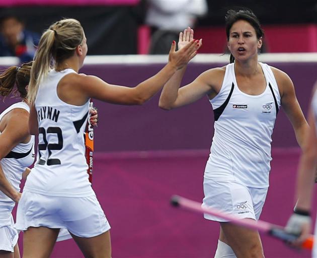 New Zealand's Kayla Sharland celebrates her goal with teammate Gemma Flynn. REUTERS/Dominic...