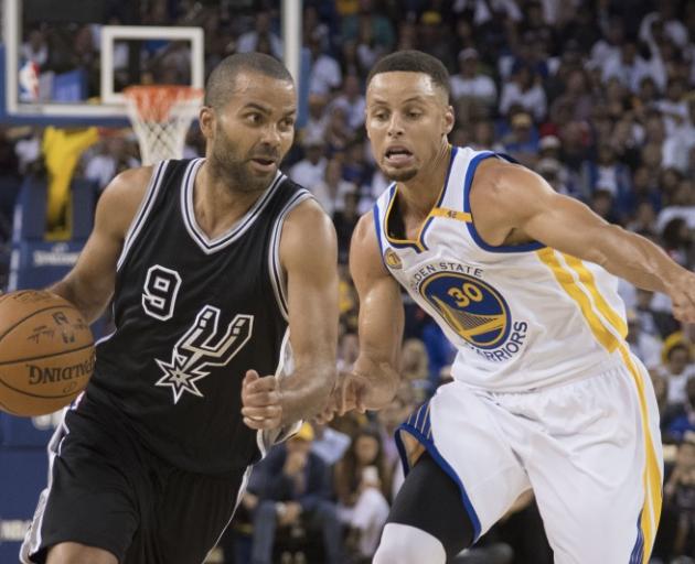 Spurs guard Tony Parker drives past Warriors guard Stephen Curry. Photo: Reuters