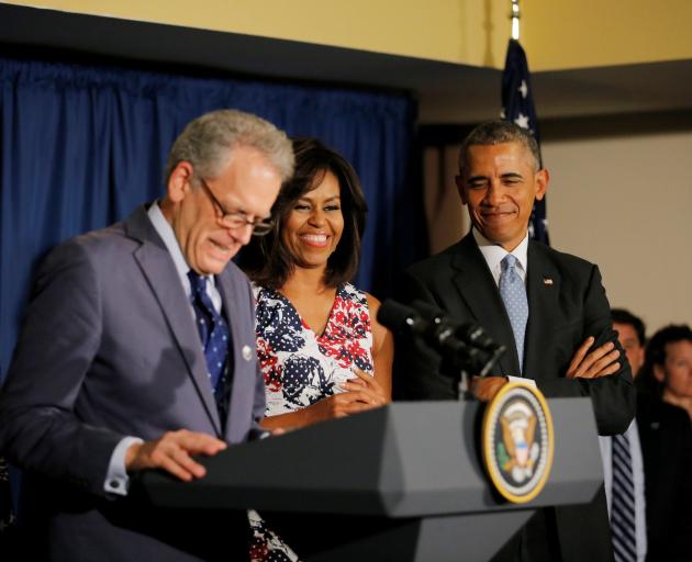  US President Barack Obama and his wife, Michelle, stand with US ambassador to Cuba Jeffrey De Laurentis as they meet  embassy staff in a hotel in Havana earlier this year. Photo from Reuters.