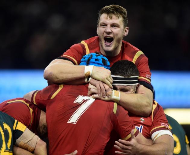 Welsh players celebrate a try against South Africa. Photo Reuters