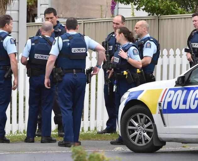 Police gather outside a property at Abbotsford after the locals reported hearing a gun shot....
